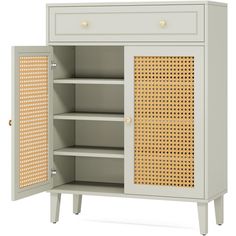 an open cabinet with wicker doors and drawers on the bottom, in front of a white background