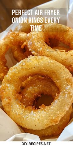 some onion rings are in a basket with the words perfect air fryer onion rings every time