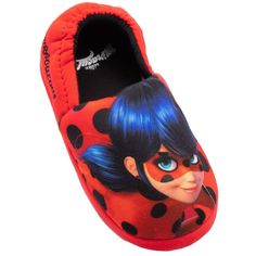 a close up of a child's slipper with a lady bug on it