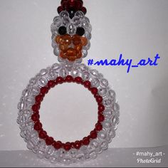 a close up of a beaded turkey ornament on a white background with the words mary - art above it