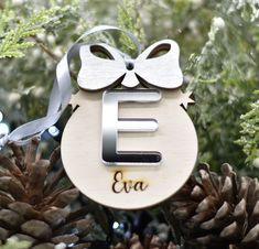 a wooden ornament with the letter e on it