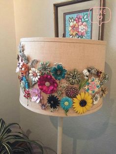 a lamp that has some flowers on it