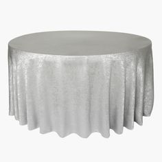 a round table with silver cloth on it