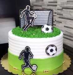 a cake decorated with soccer themed icing