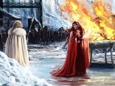 two women dressed in red standing next to each other near a fire and ice covered building