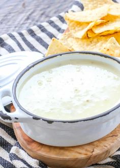 a bowl of soup with tortilla chips on the side