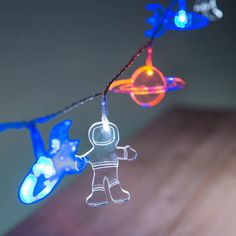 a string of lights that have an astronaut on it