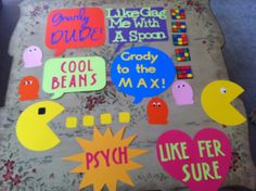 some stickers that are on top of a pillow with words and shapes around them