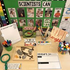 a table topped with lots of crafting supplies and writing paper on it's sides