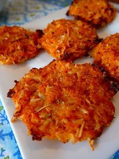 four crab cakes on a plate ready to be eaten