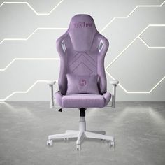 a purple office chair sitting in front of a white wall