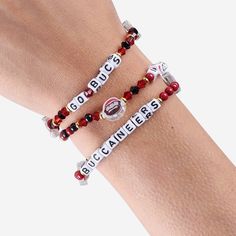 Accessorize and maximize your fandom while impressing your fellow fans with this Tampa Bay Buccaneers 3 Pack Friendship Bracelet. These matching friendship bracelets have an all-over team-colored design and team logo displays, which makes them the perfect way to show your support for the Tampa Bay Buccaneers and get in on the latest accessory craze. Every bead bracelet design is the perfect addition to your outfit, whether you’re heading to the game, watching at home, or just hanging out with fr Tampa Buccaneers, Matching Friendship Bracelets, Cool Friendship Bracelets, Make Friendship Bracelets, Friendship Bracelets With Beads, Beads Bracelet Design, Hanging Out With Friends, Colored Gems, Bracelet Design