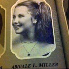 an old photo of a woman with long hair and a smile on it's face