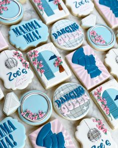 decorated cookies are displayed on a table