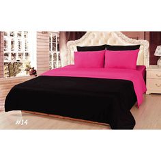 a bedroom with pink and black bedding in it