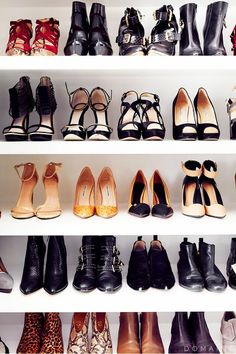 there are many pairs of shoes on the shelves