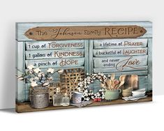 a wooden sign that says the kitchen family recipe on it, with flowers and other items