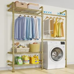 a washer and dryer sitting next to each other in front of a clothes rack