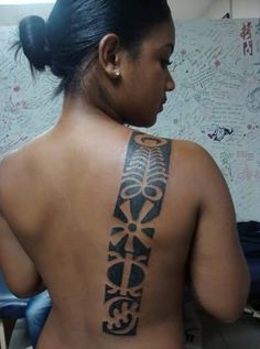 a woman with a tattoo on her back