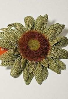 a brooch that has been made to look like a flower