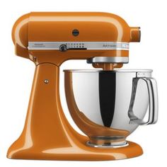 an orange stand mixer on a white background