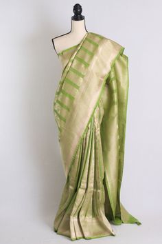 Pure Katan Brocade Banarasi Saree with Zari in Green and Brushed Gold. The saree is fall pico done ready to wear. It DOES come with an unstitched blouse piece that is cut and separated from the saree. Note: Product color may slightly vary due to photographic lighting sources or your device settings. Handwoven articles might have minor irregularities in the embroidery/weave/Dye that are not to be considered defective. Pista Green Art Silk Pre-draped Saree For Puja, Festive Pista Green Banarasi Silk Pre-draped Saree, Pista Green Blouse Piece With Zari Weaving For Festivals, Pista Green Banarasi Silk Blouse With Zari Weaving, Transitional Pista Green Pre-draped Saree With Pallu, Pista Green Tissue Silk Blouse Piece With Pallu, Pista Green Banarasi Silk Blouse Piece With Dupatta, Pista Green Pre-draped Saree With Pallu In Tissue Silk, Pista Green Pre-draped Saree With Zari Weaving