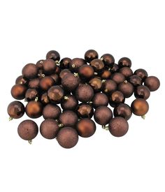 a pile of brown christmas balls sitting on top of each other