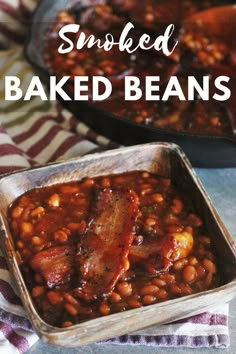 baked beans in a metal pan with bacon on top and the words smoked baked beans above it