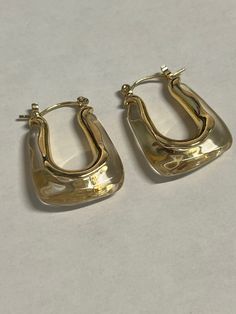 Talia squared hoop earrings in gold and clear. Simple style for everyday. Hypoallergenic Rectangular Hoop Earrings, Trendy Square Gold Jewelry, Everyday Gold Rectangular Hoop Earrings, Classic Gold Square Earrings, Chic Gold Rectangular Jewelry, Chic Rectangular Gold Jewelry, Gold Rectangular Everyday Earrings, Gold Rectangular Earrings For Everyday, Classic Square Face Jewelry As A Gift