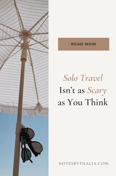 an umbrella with the words, solo travel isn't as scary as you think