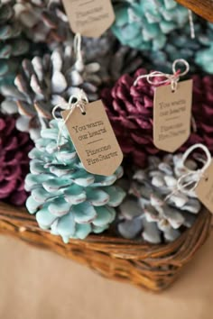 some pine cones and tags are in a basket