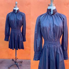 Witchy black dress smocked waist and sleeve cuffs high neck (could fold down as well) fit/flare side zipper feels like cotton or cotton blend EUC XL - 2XL Bust: 52" Waist: 36-40" Hip: 62" Shoulder to hem: 33=4" INSTAGRAM: @macabreatheart Dark Cottagecore, Black Mini Dress, Smock Dress, Black Mini, Dress Clothes For Women, Mini Black Dress, Fit & Flare, Fit And Flare, Vintage Black