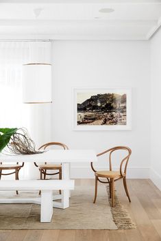 a white table and chairs in a room