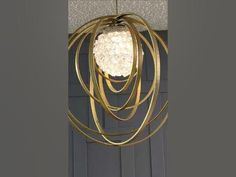 a chandelier hanging from the ceiling in front of a door