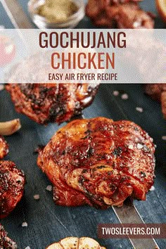 grilled chicken on a grill with garlic and seasoning next to it is text overlay that reads gochuang chicken easy air fry recipe