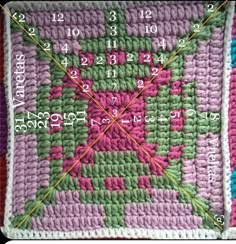 a crocheted square with numbers and times on the side, as well as an arrow