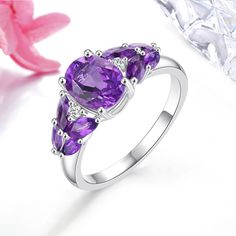 Elegant Vintage 2.5 Carat Natural Amethyst and Silver Ring with Classic Design This sterling silver ring embodies a luxurious and classic style, featuring a stunning deep purple 2.5 carat natural Amethyst gemstone, reminiscent of vintage elegance. Timeless Craftsmanship Crafted with precision and sophistication, this ring is a perfect addition to any jewelry collection. Its vintage design makes it suitable for various occasions, from casual outings to formal events. Gemstone Quality Metal: 925 S Classic Elegant Style, Purple Gems, Vintage Elegance, Classic Elegant, Fine Rings, Amethyst Gemstone, Classic Vintage, Deep Purple, Vintage Design