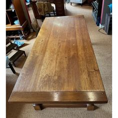 a large wooden table sitting in a room