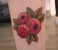 a close up of a person's leg with tattoos on it