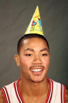 a man with a birthday hat on his head