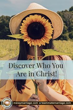 a woman holding a sunflower with the words, discovering who you are in christ