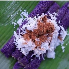 purple and white food on a banana leaf