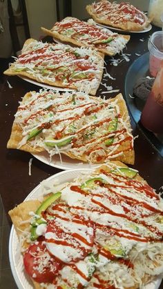 several pizzas are lined up on the table