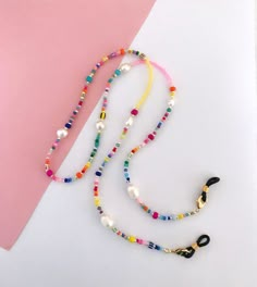 For more chains, please check out these listings: https://www.etsy.com/no-en/shop/Pearlsbymimmi?ref=simple-shop-header-name&listing_id=935334066&section_id=32595269 Delicate and colorful eyeglass and mask chain. I made it to look colorful and happy and allow you to wear your mask og glasses around your neck when not in use. Its also make a colorful long necklace. Silicone ends are adjustable to fit most glasses. Lobster claw attachments make it easy to replace silicone ends after too much wear & Spectacle Chain Diy, Sunglasses Beaded Chain, Beads Glasses Chain, Diy Glasses Chain, Glasses Chain Diy, Glasses Holder Necklace, Eye Glass Chain, Beaded Mask Chain, Beaded Glasses Chain