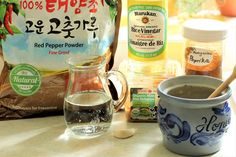 ingredients to make hot chocolate are displayed on a counter top, including coffee and sugar