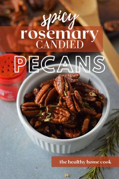 a white bowl filled with pecans on top of a table