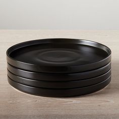 three black plates stacked on top of each other