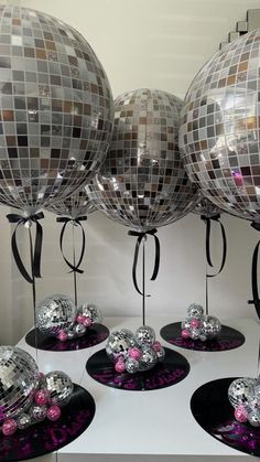 disco ball decorations are on display in front of the mirror balls that have been placed on top of each other