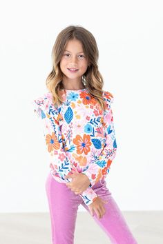 Our ruffle tee in vibrant prints is a favorite to pair with solid twirl skirts, leggings, or layered under a pinafore! Matching Twirl Dress available for sister, cousin or BFF. INSTRUCTIONS: Wear-Twirl-Repeat FIT & FABRIC & CARE: True to Size Polyester/Spandex Machine Wash/Tumble Try Low Tuxedo Accessories, Toddler Flower Girls, Girly Outfit, Girls Gloves, Girls Dress Outfits, Toddler Flower Girl Dresses, Infant Flower Girl Dress, Twirl Skirt