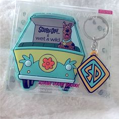 a keychain shaped like a bus with a dog on the front and back